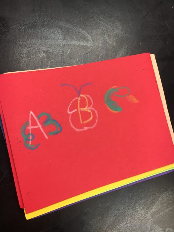 "A B C" written on red paper