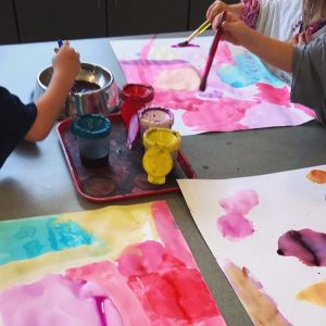 children painting with watercolor