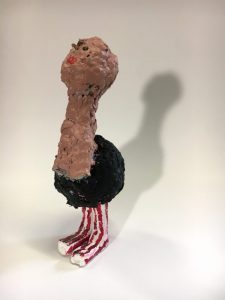 ostrich with straw legs