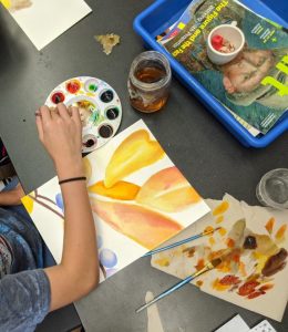 student painting watercolor