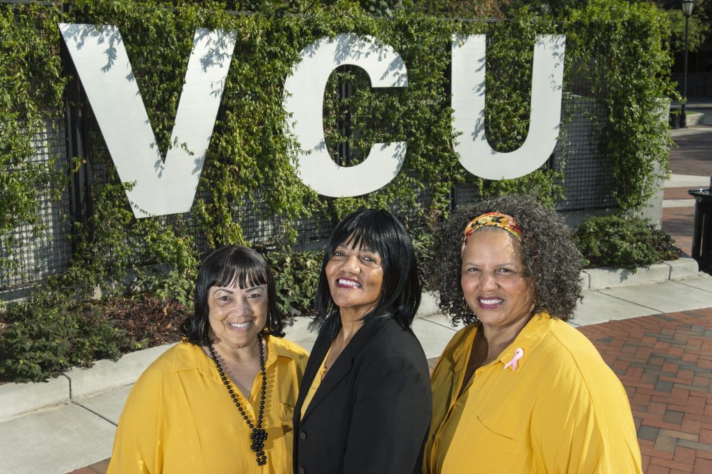 (From left to right) Sisters Adriene Hall Johnson, Rhonda Hall and Octavia Hall each celebrated milestone work anniversaries this week. (Photo by Kevin Morley, University Marketing)