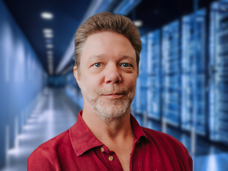 Peter Aiken headshot - data center background