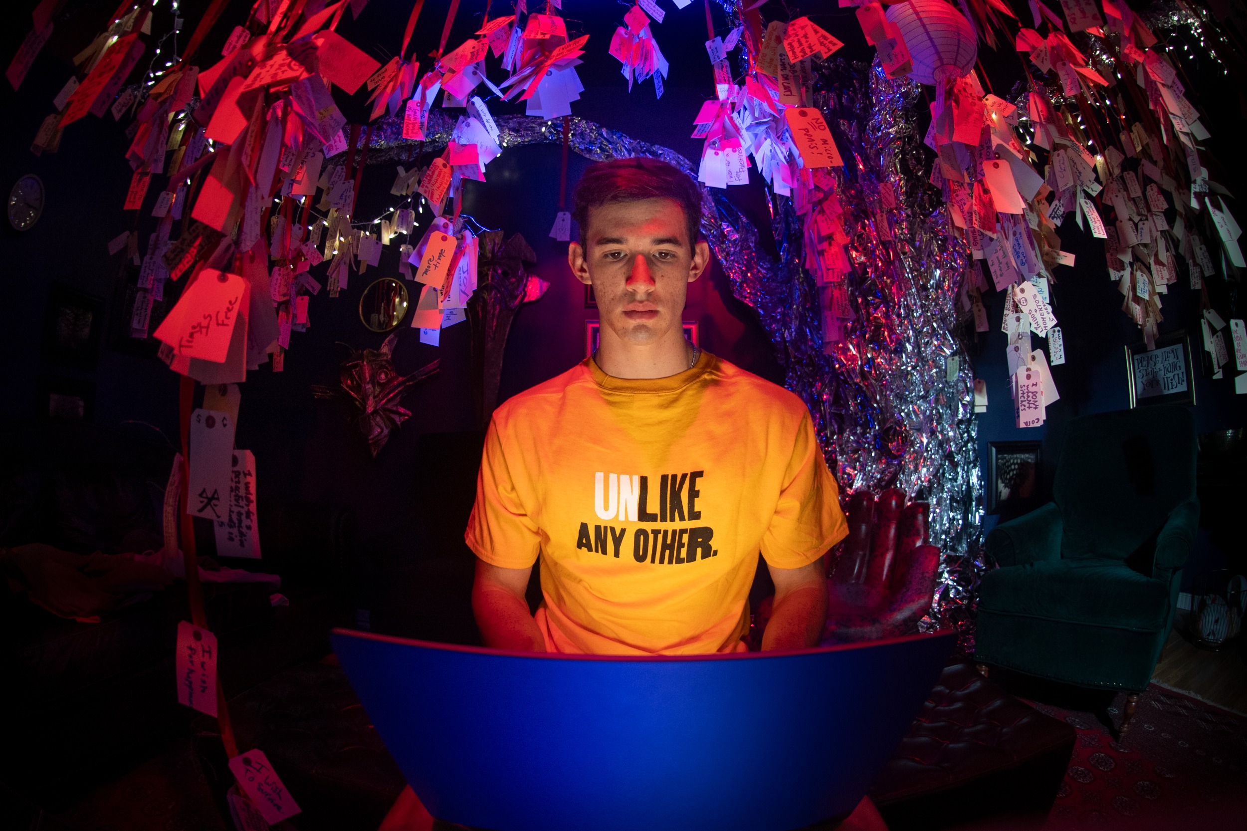 Student wearing a VCU tshirt works at a laptop