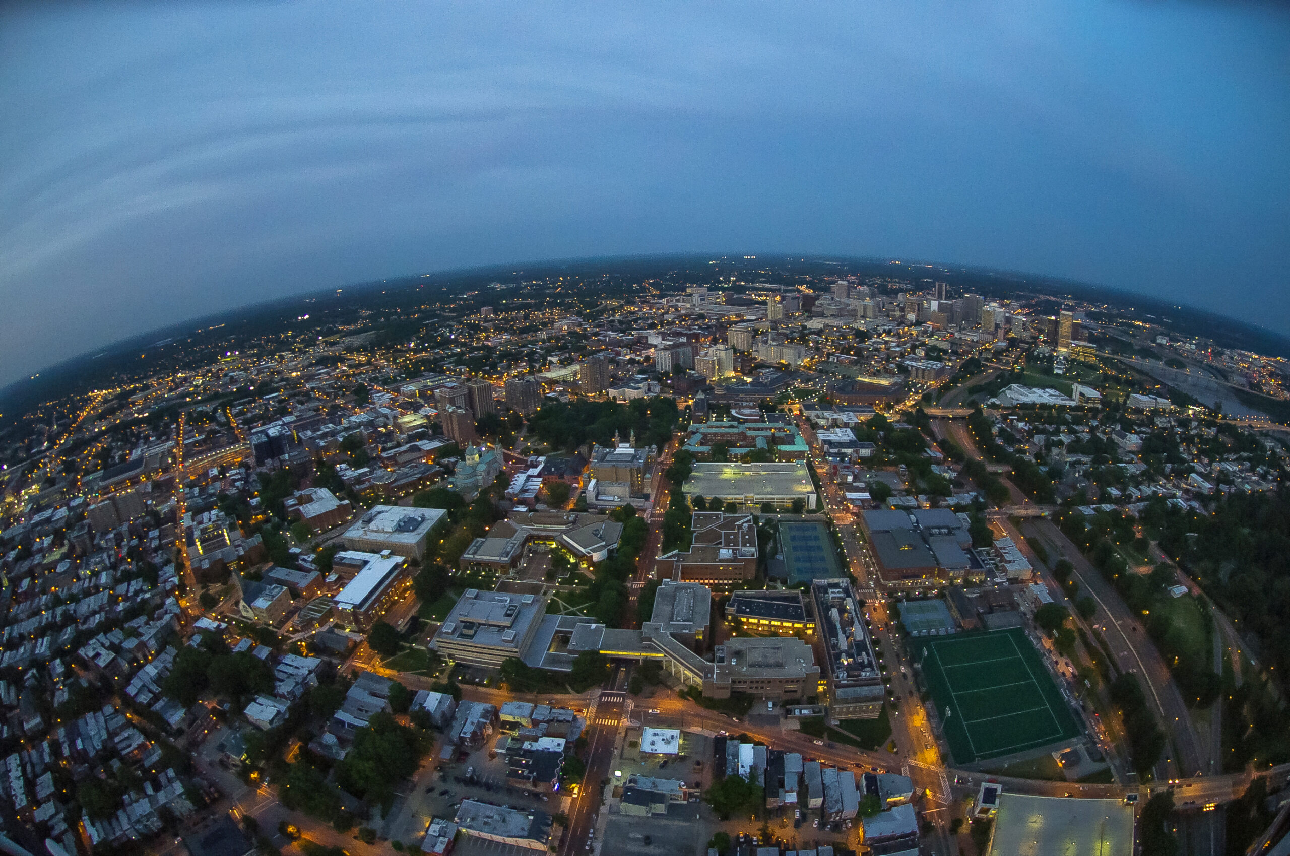 Aerial photography of VCU's Monroe Park campus and downtown Richmond, VA at night time.