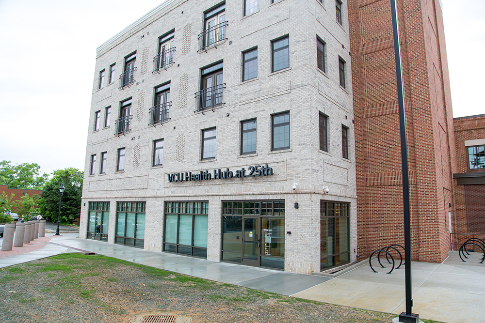 Exterior of the VCU Health Hub at 25th building, a multi-story building with many windows. The hub is located on the first floor.