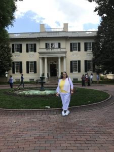 Betty Palmer takes a walk by the Governor's Mansion on a DAR lunch break.