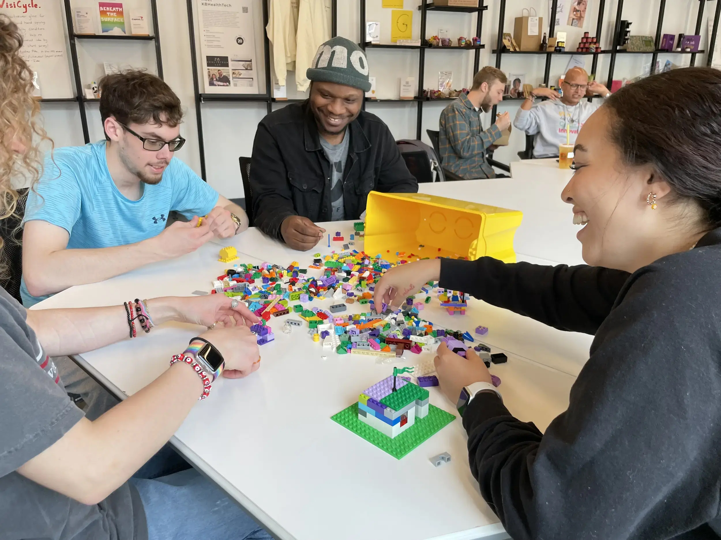 At the Shift Retail Lab of the VCU da Vinci Center, Shift interns Camryn Anderson, Ian Devenish, Tony Ward and Bri Domenech (left to right) collaborate with LEGO. (Brian McNeill, VCU Public Relations)