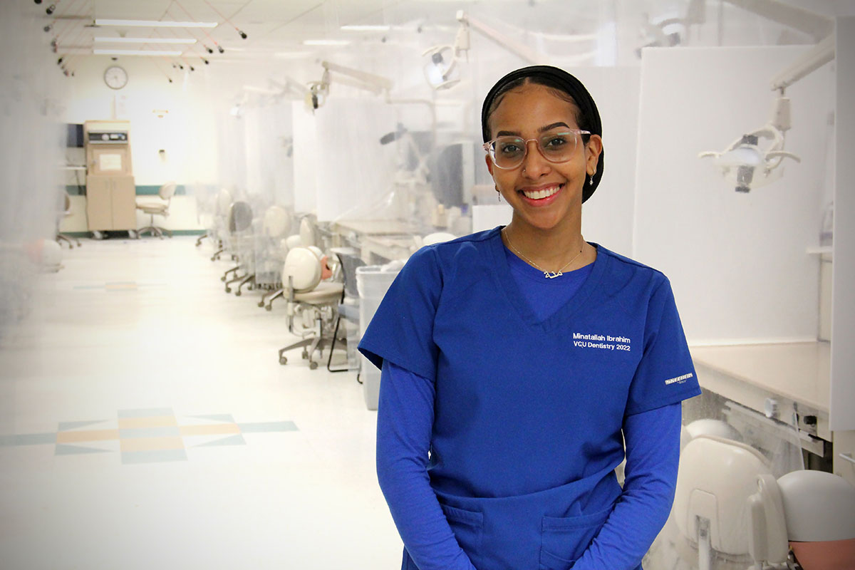 Picture of Minatallah Ibrahim standing in the simulation lab at VCU School of Dentistry