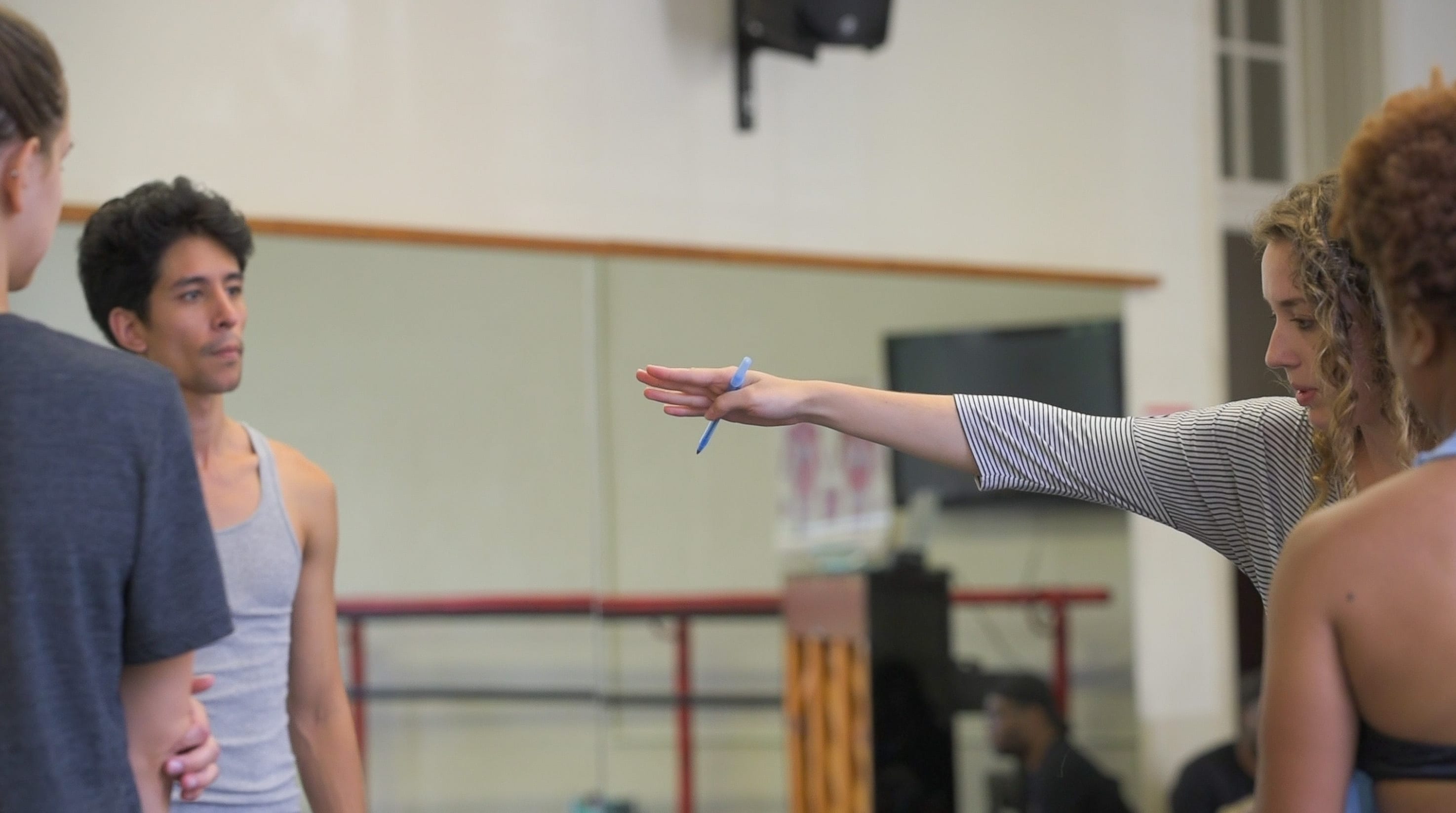 Kara Robertson (B.F.A.'16/A) instructs her dancers during choreography practice.