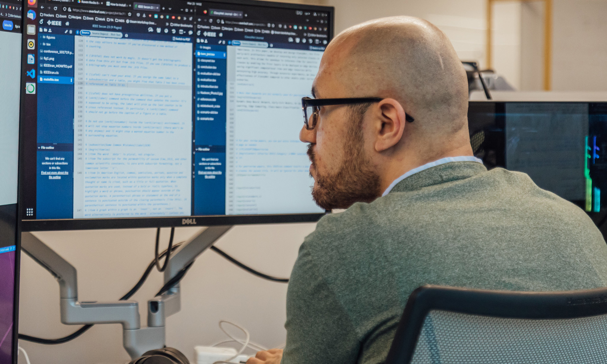 A student working on some code looking at a computer screen