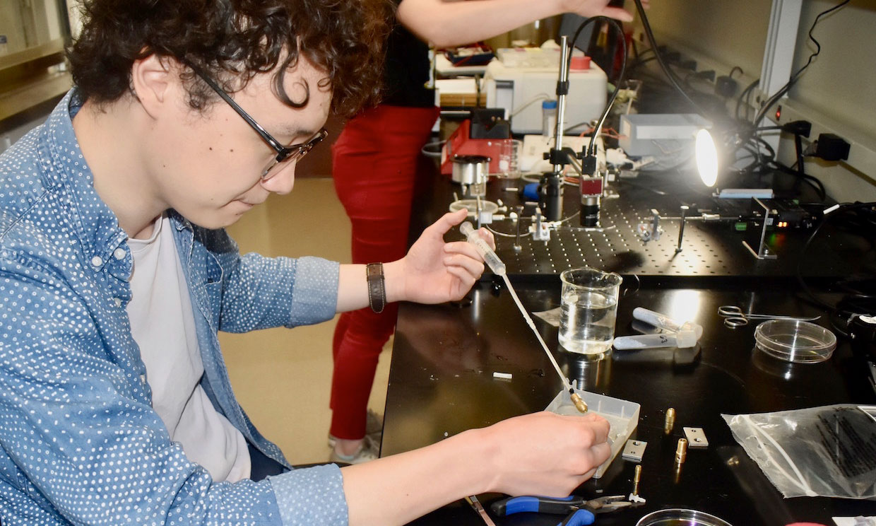 Sam Cole working in a lab