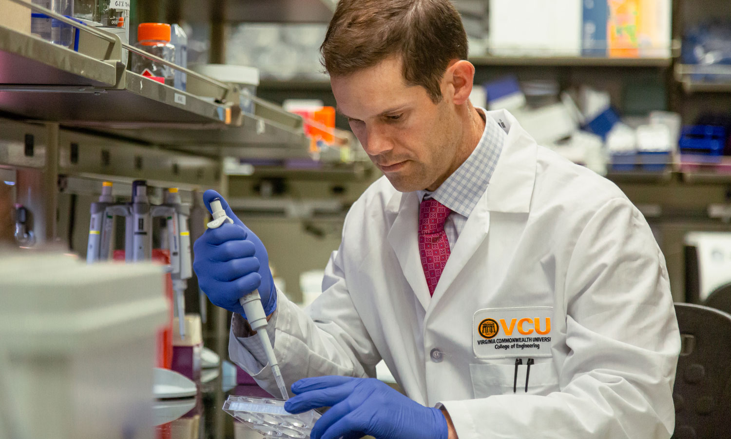 Michael McClure, Ph.D. working in a lab