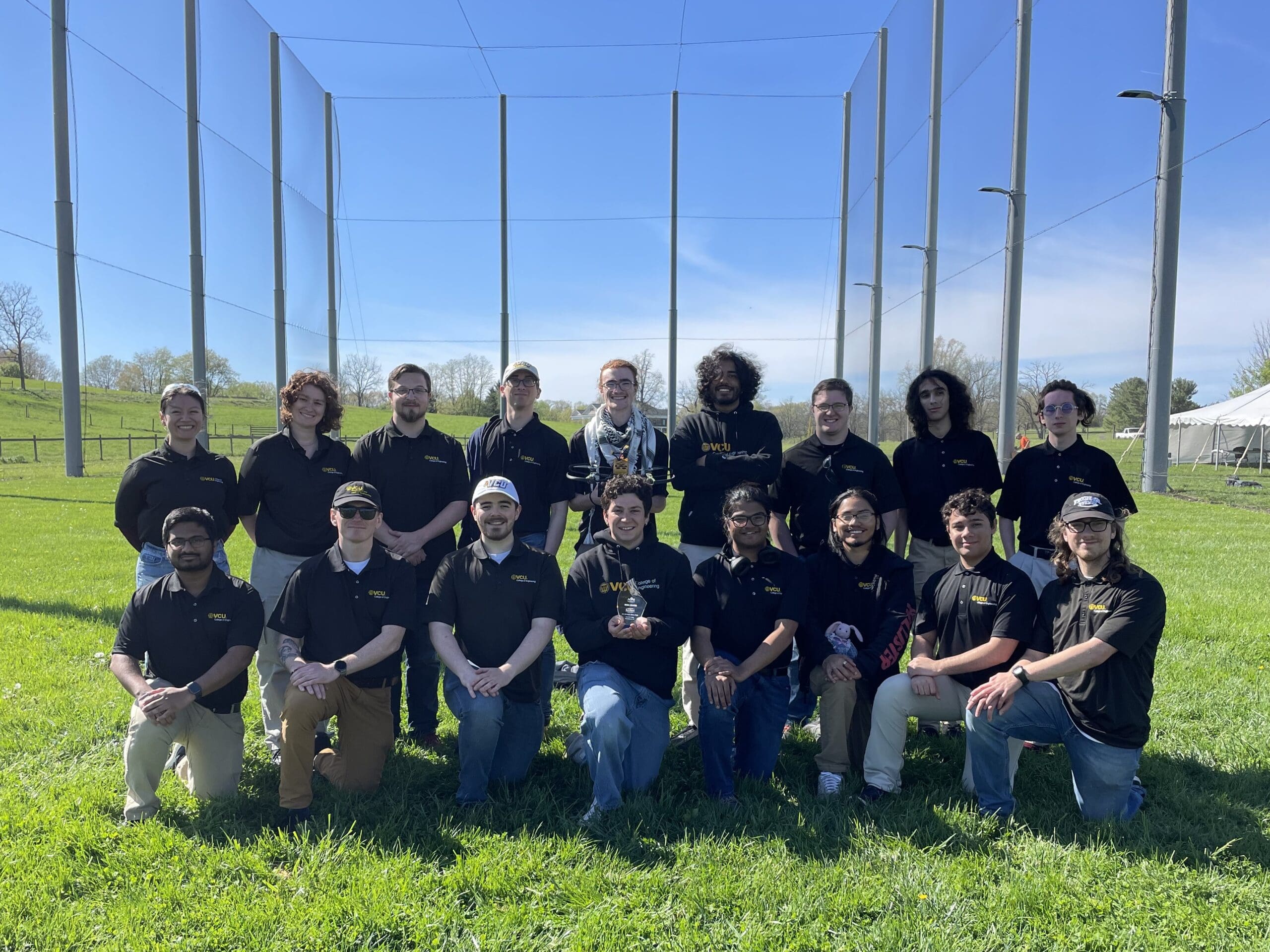  ASME at VCU posing with their award. (Left to Right Standing: Nathalia Melgarejo-Salvatierra, Autumn Brown, Zack Newman, Jacob Macina, Tyler Brown, Ishaan Thakur, Nathan Marchetti, Zade Goldrup, and Cody DuPriest. Left to Right Kneeling: Shiv Patel, Ian Gildea, TJ Tuttle, Ian Scaparo, Bitan Chowdhury, William Garnique, Martin Hanson, and Evan Haaland.)