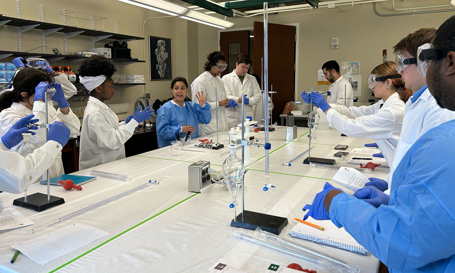 Jessika Rojas, Ph.D., instructs students on an experiment serving as an introduction to neutron counting using He-3 gas filled detectors and the effects of moderating and shielding materials.