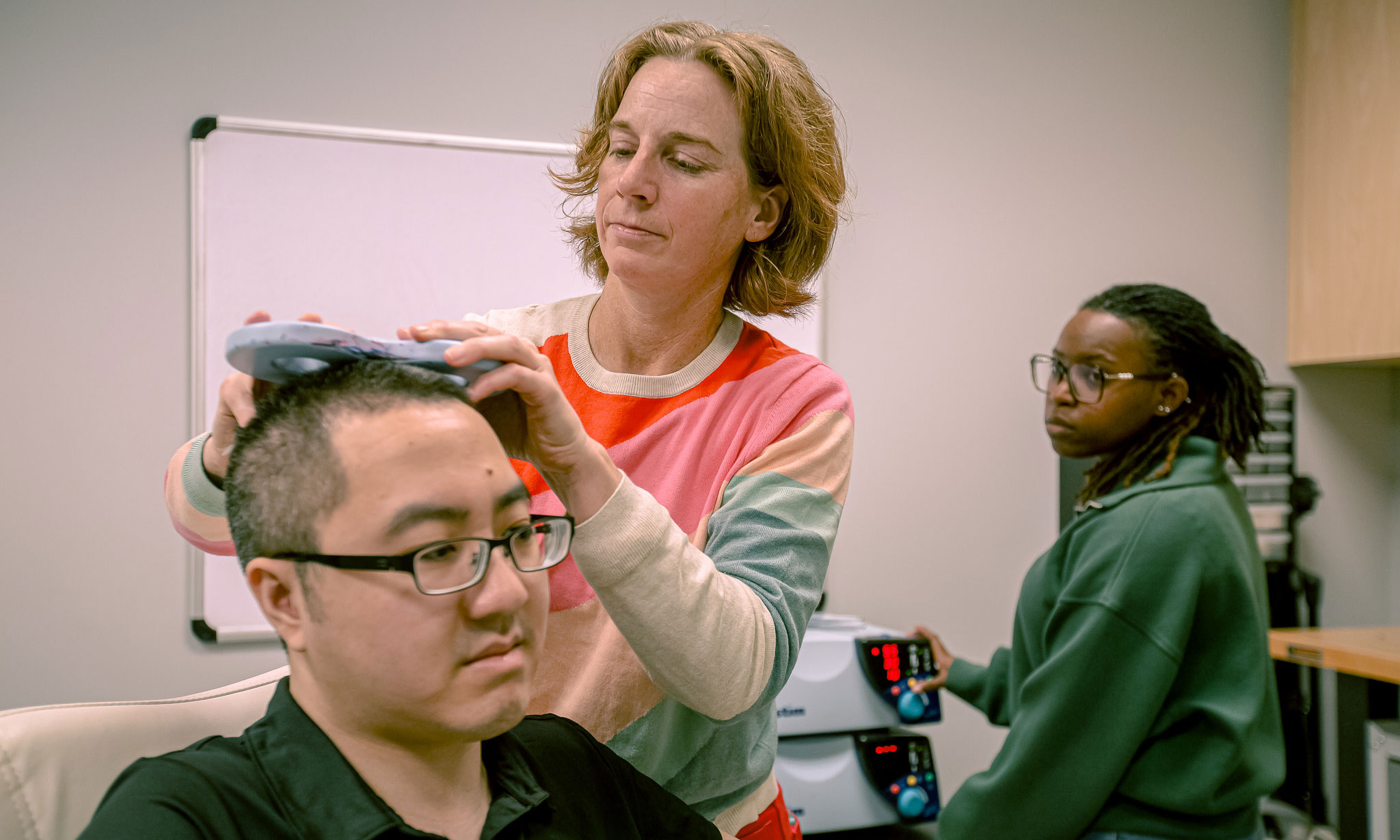 Carrie Peterson, Ph.D., collaborates with College of Engineering researchers to employ machine learning, training models on complex datasets in order to accurately predict how an individual patient will respond to treatment before the first pulse is ever delivered.
