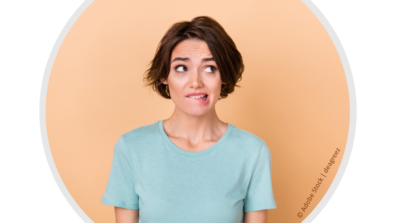 Allison is a girl with light skin and short brown hair, wearing a short sleeved, pale green t-shirt. She is biting her lip and rolling her eyes to show that she is worried about getting in trouble because she forgot to deposit a large check from a donor.