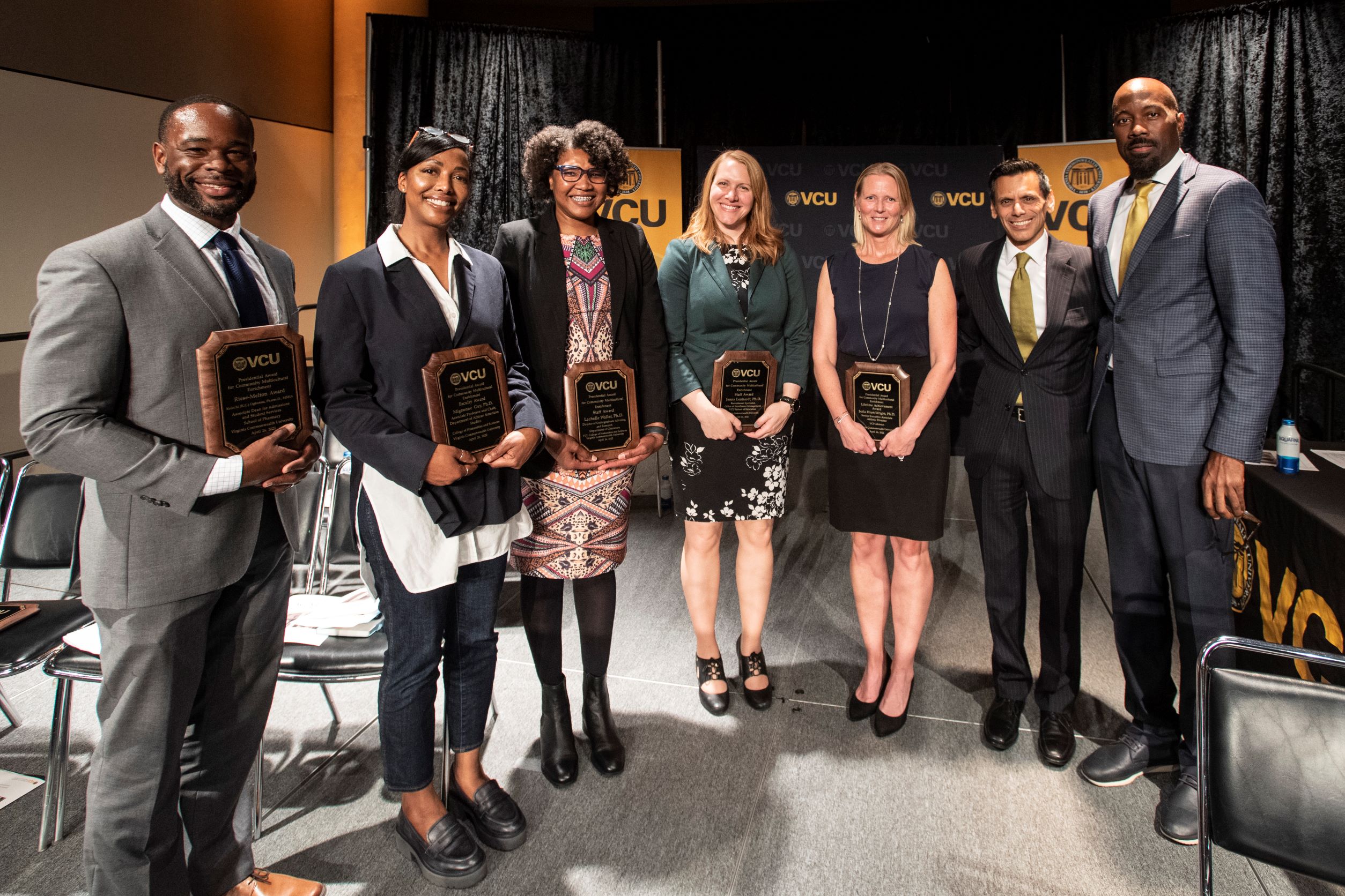 2022 PACME recipients pose with their awards. To the right are VCU president Michael Rao and IES VP Aashir Nasim.