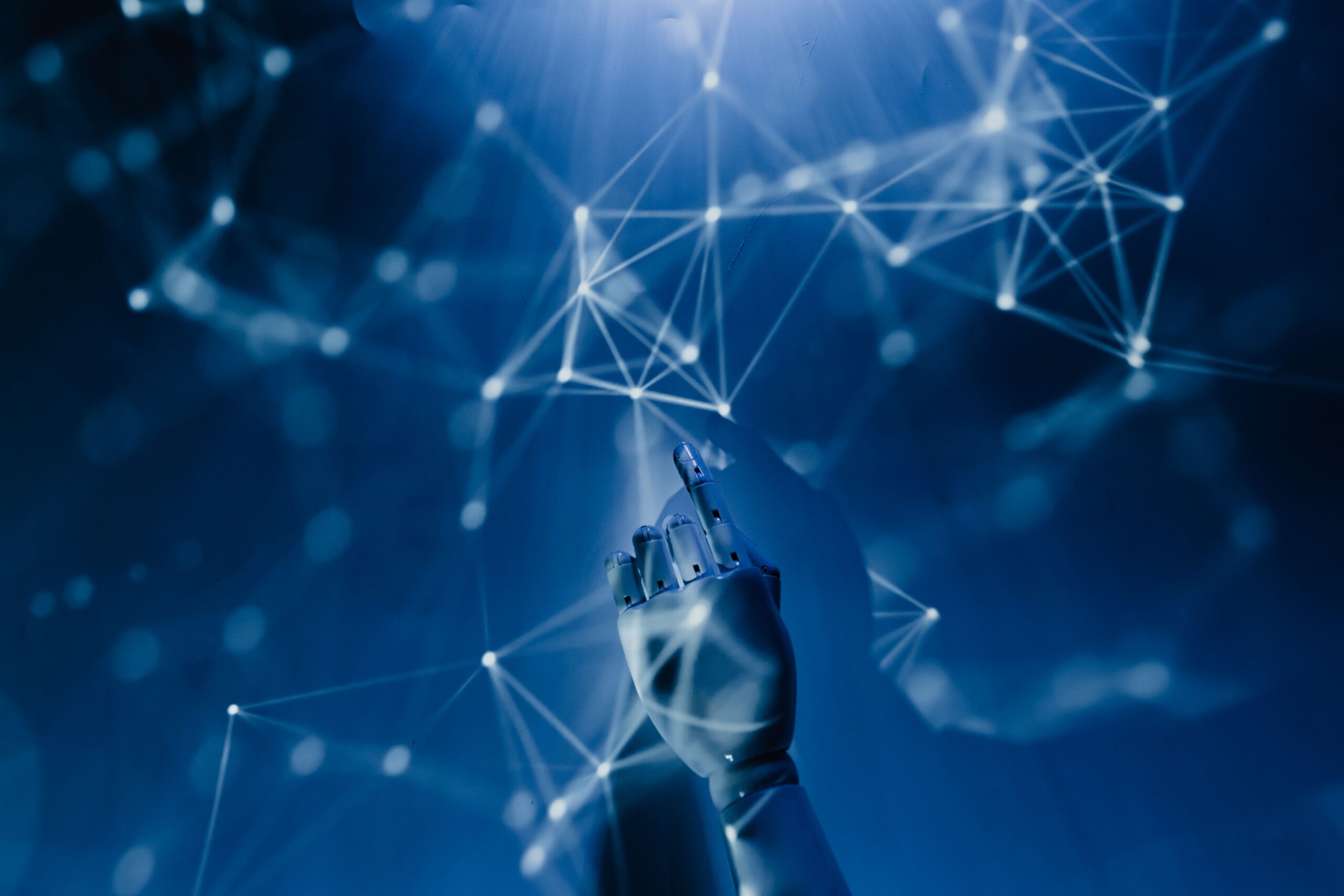 Artificial hand reaching towards constellations (gemini)
