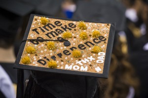 "Time to make a difference" message on graduate's cap.