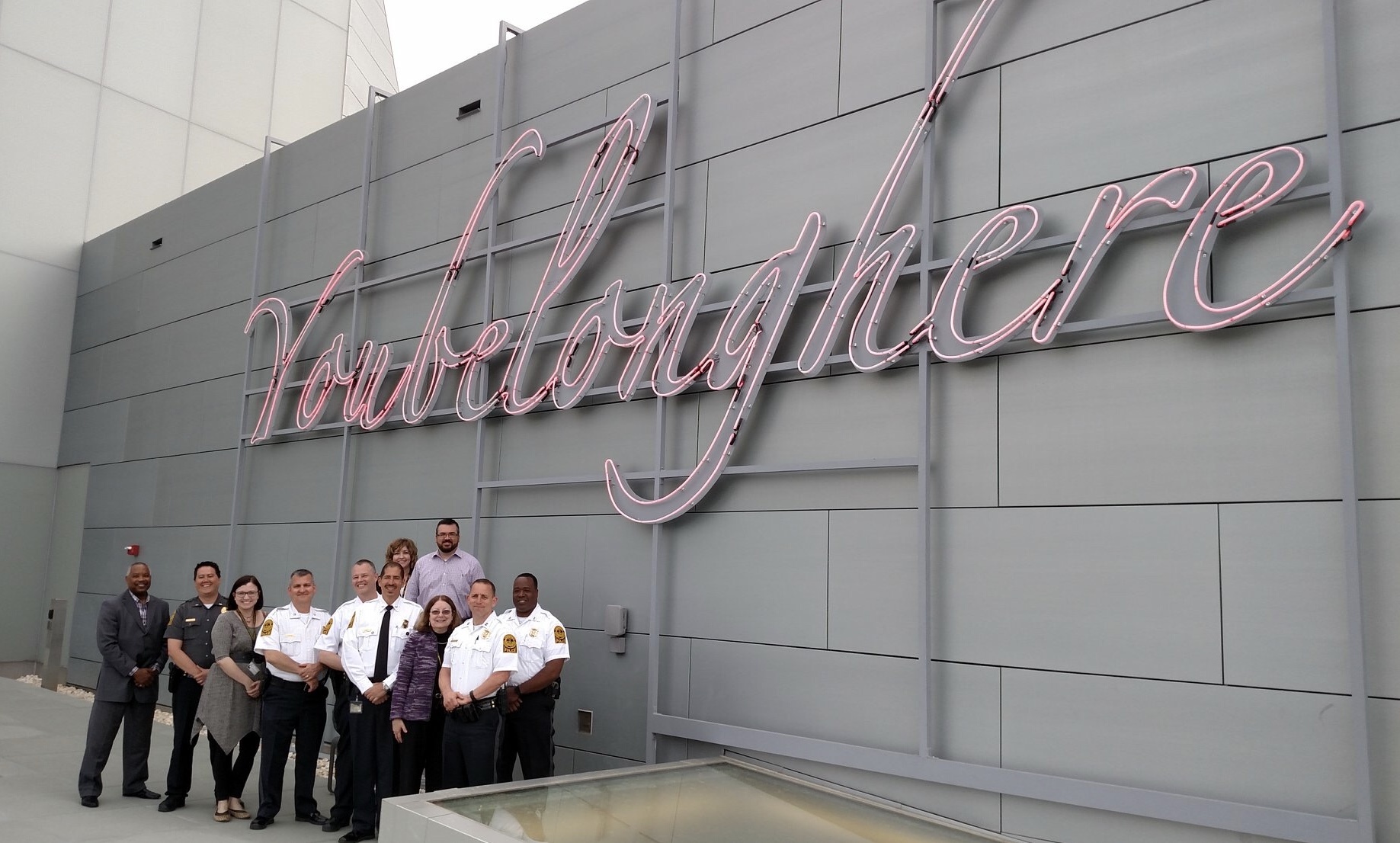 Members of VCU Police standing near Tavares Strachan's "You Belong Here (Flamingo II)" located on the top floor of ICA