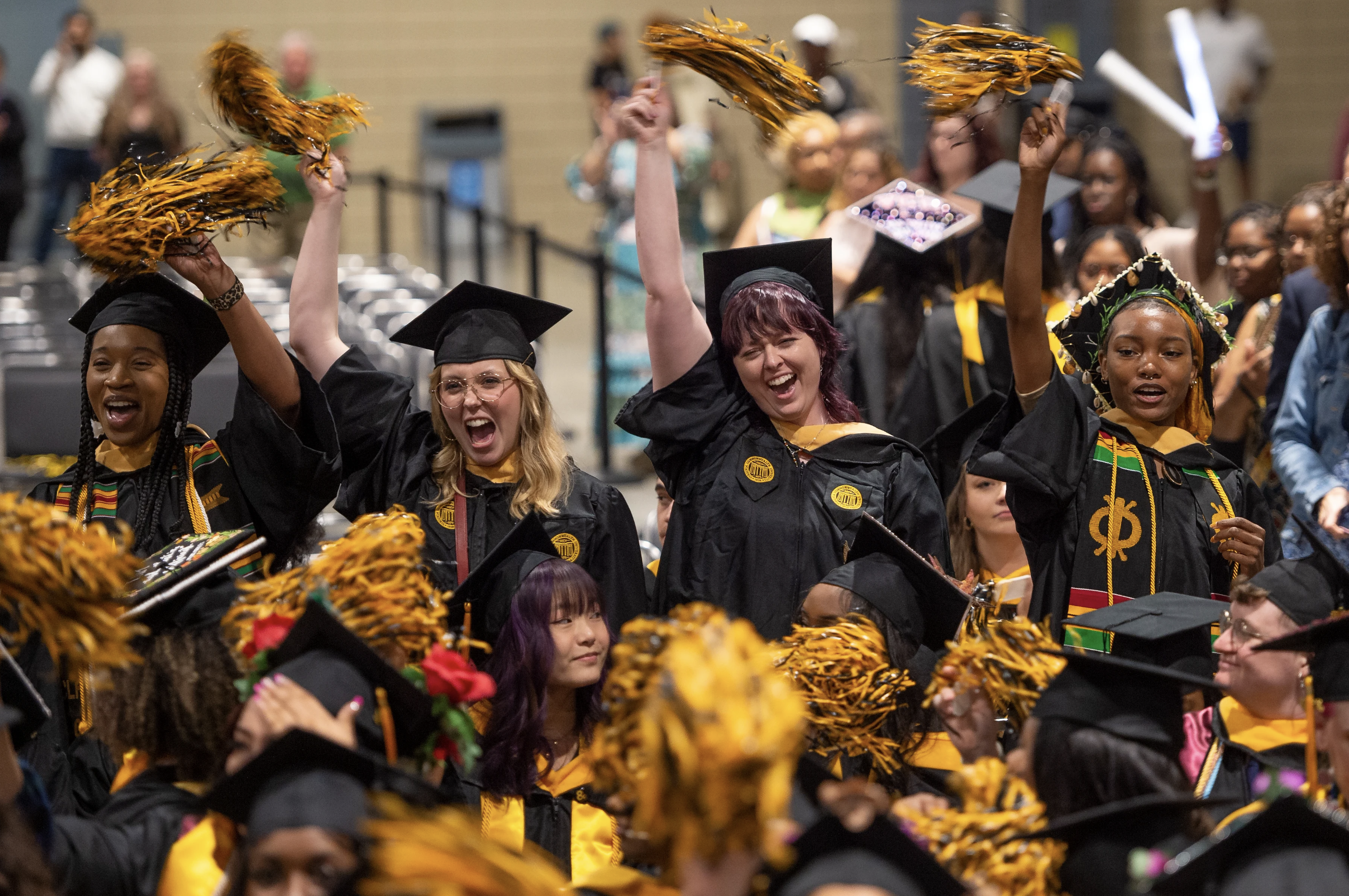 new graduates celebrating at VCU commencement