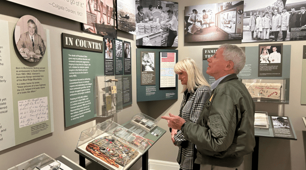 2 people viewing the vietnam exhibit at the vmhc