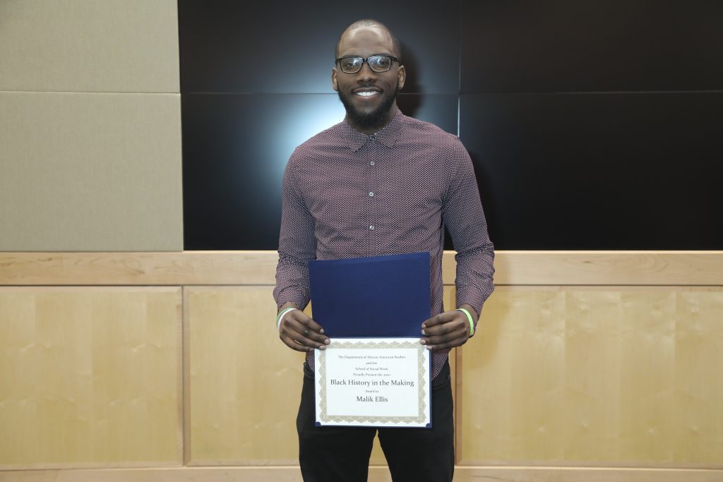 B-S-W student Malik Ellis, holding his Black History in the Making certificate