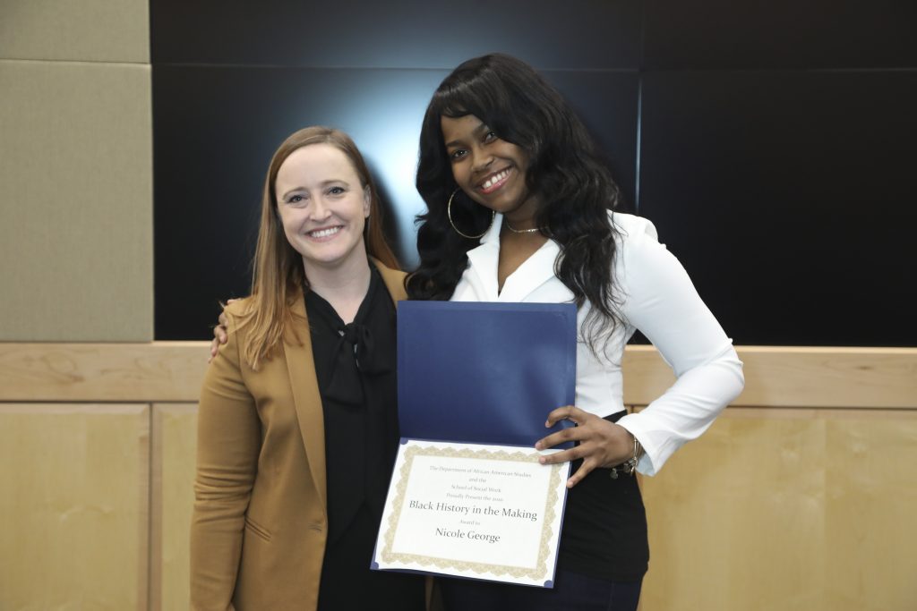 Dr. Shelby McDonald with M-S-W student Nicole George, holding her Black History in the Making certificate