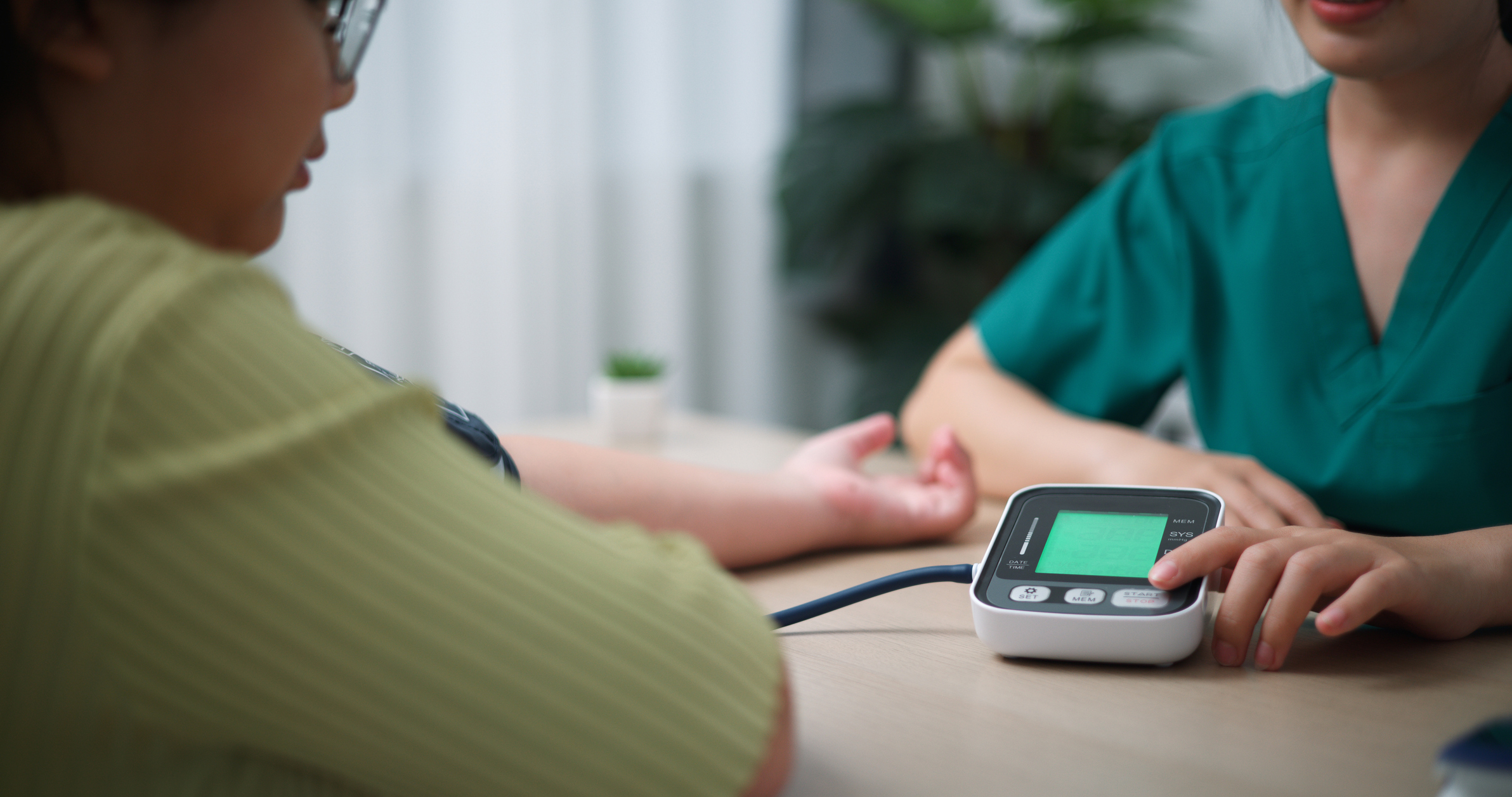 a patient reviews their heart rate on a monitor with a health professional