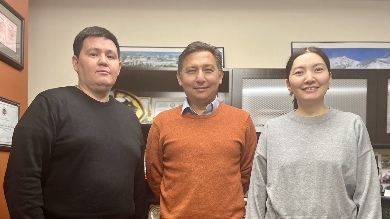 Scholars Nurzhan Klyshbekov, M.D. and Assel Sadykova, M.D. stand with program director Askar Chukmaitov, Ph.D.