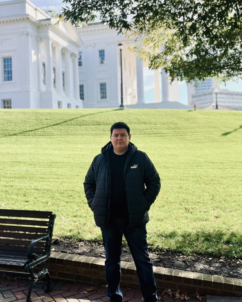 Nurzhan Klyshbekov, M.D. stands at Capitol Square in Richmond, VA.