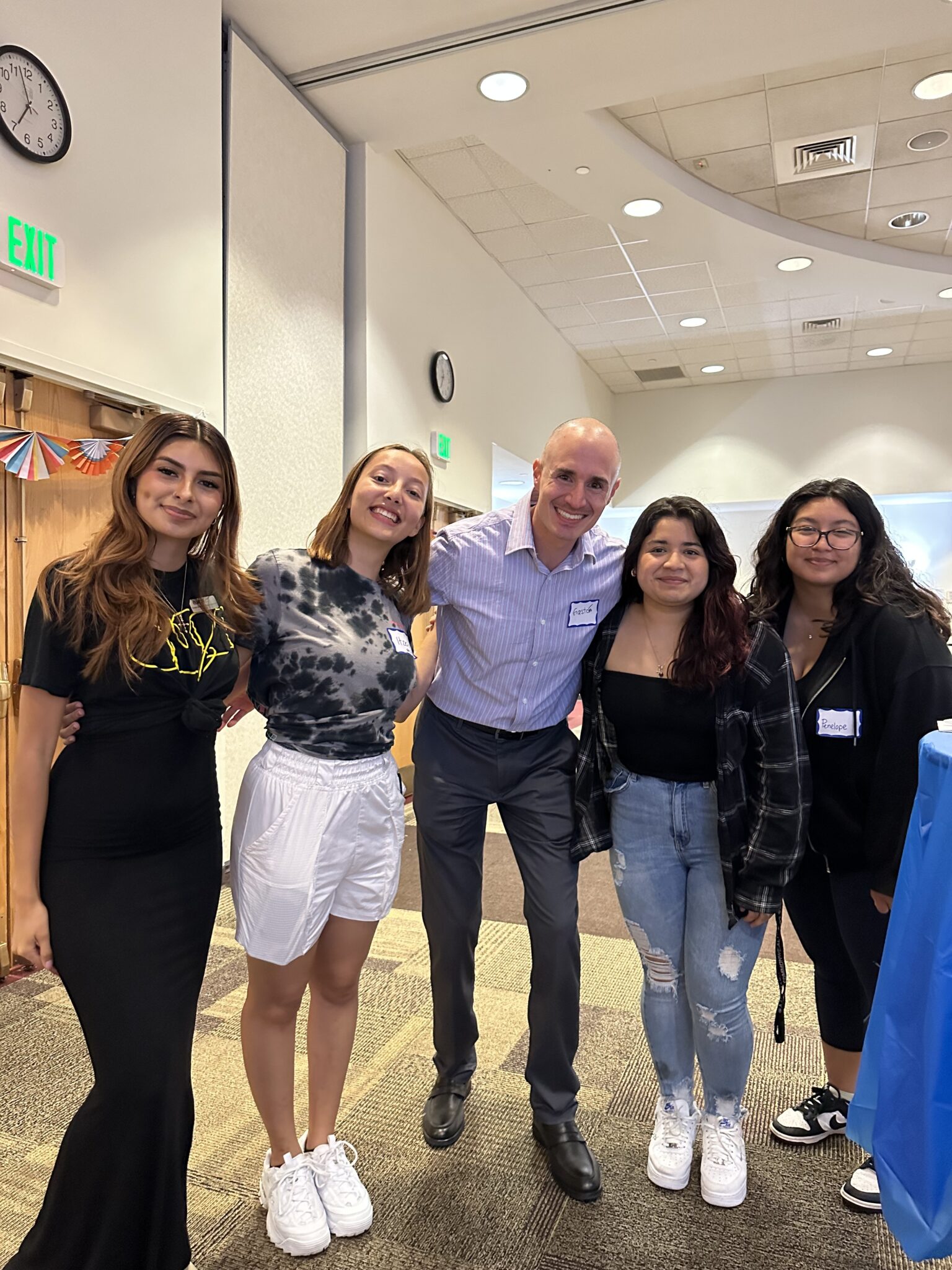 Students engaging with staff at a student, faculty and staff mixer presented by the Office of Multicultural Student Affairs.