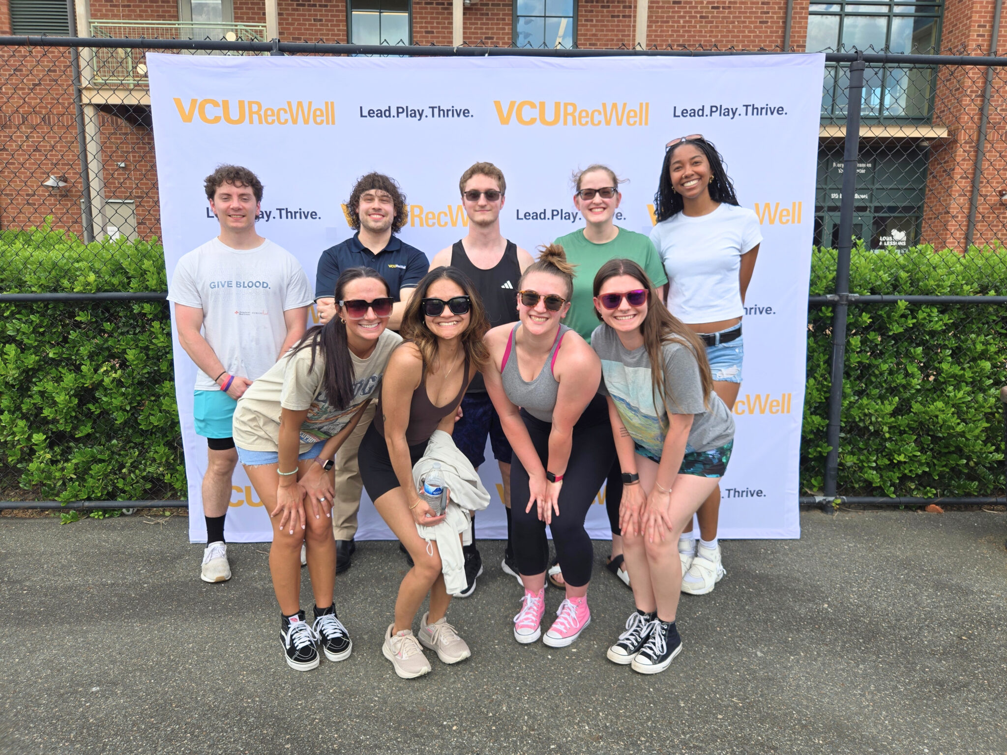 RecWell team members posing for a photo at an event.