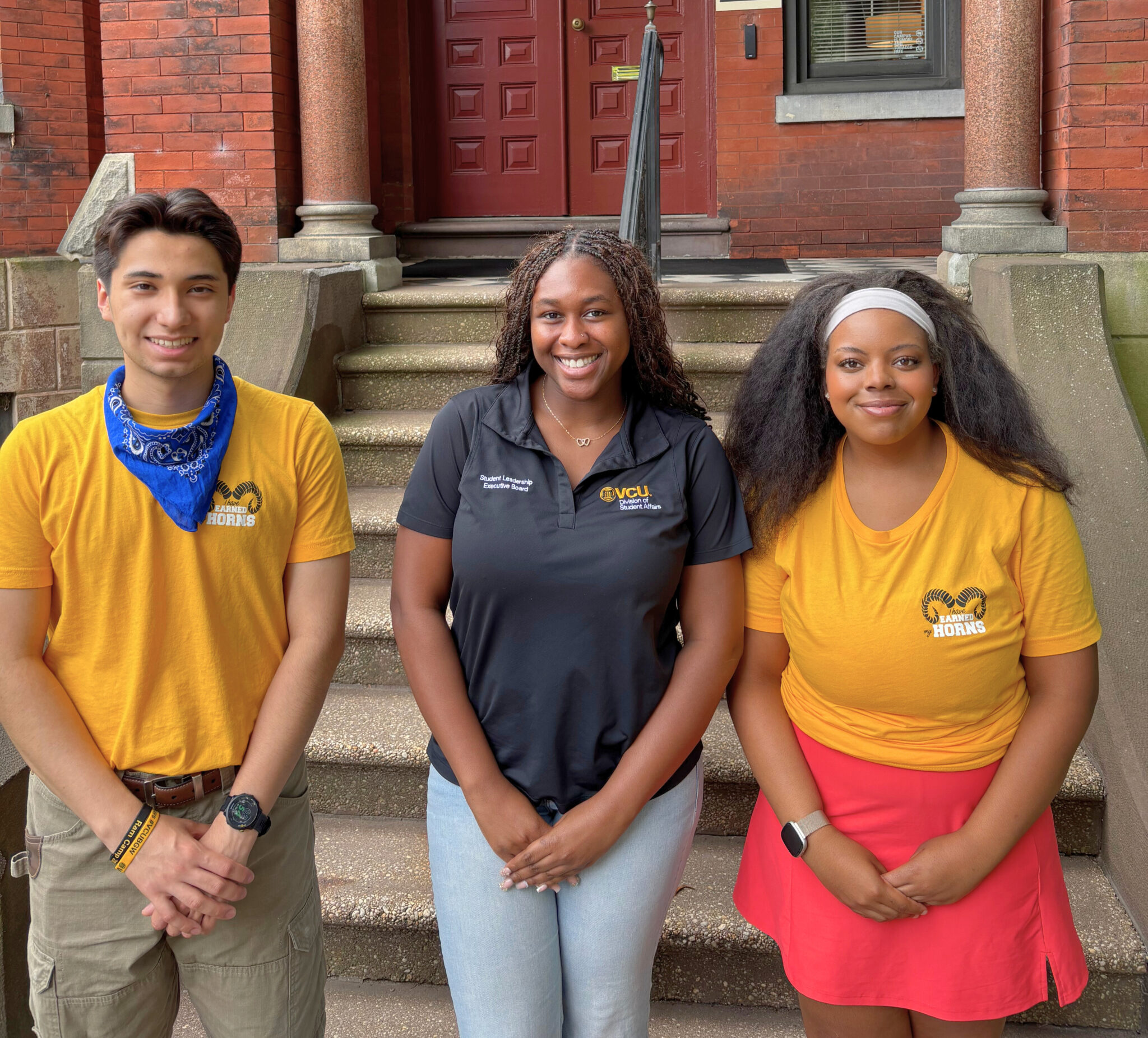 Photo of three members of SLEB in front of Sitterding House
