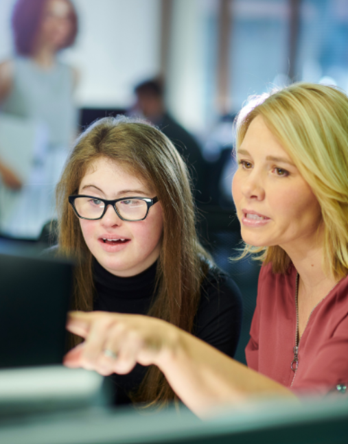 Image of a teacher working with a student