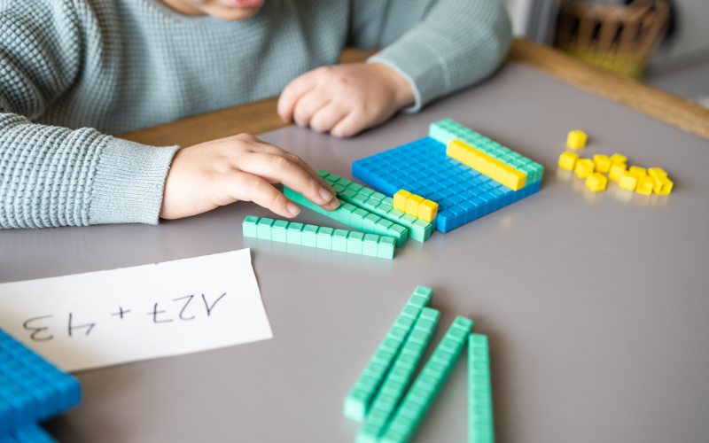 Child using math manipulatives