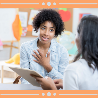 Photo of two adults sharing information