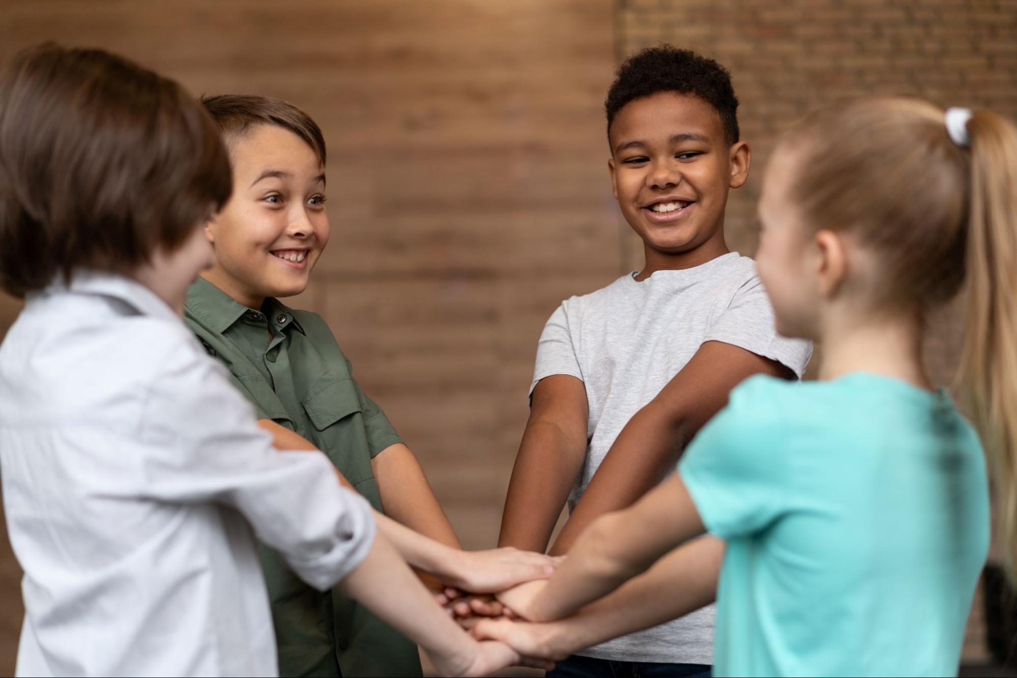 Image of four children holding hands in a circle